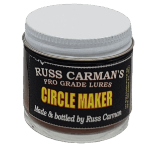 Jar of Carman's Pro Grade Circle Maker Lure, premium coyote lure with a white screw-on lid and black label.