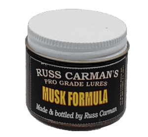 A jar of Carman's Pro Grade Musk Formula by Russ Carman, featuring a white lid.