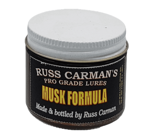 A jar of Carman's Pro Grade Musk Formula by Russ Carman, featuring a white lid.
