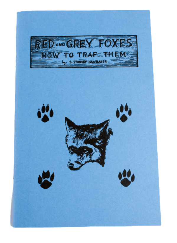 Blue booklet titled "S. Stanley Hawbaker - Red and Gray Foxes: How to Trap Them," featuring fox and paw prints illustration.