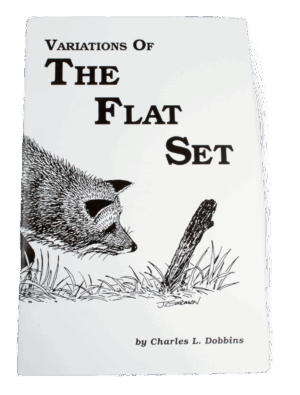 Book cover titled "Charles Dobbins - Variations of the Flat Set," with a fox near a stick in grass; ideal for trappers.