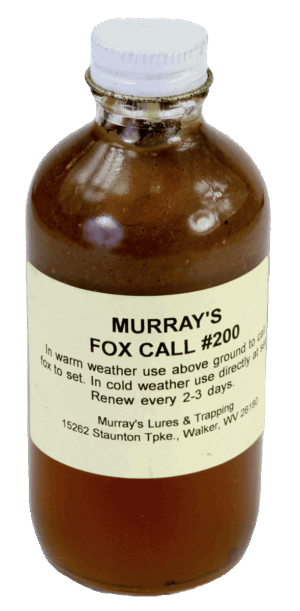 A bottle of "Murray's Fox Call #200 Lure" holds brown trapping liquid, includes usage instructions, and contact details.