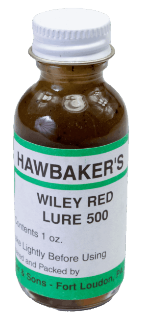 Hawbaker's Wiley Red Lure 500 is a 1 oz. glass bottle with brown liquid trapping lure and usage instructions.
