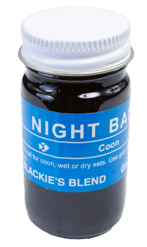 A jar labeled "Blackie's Night Bandit Lure" contains a dark liquid for trapping wildlife.