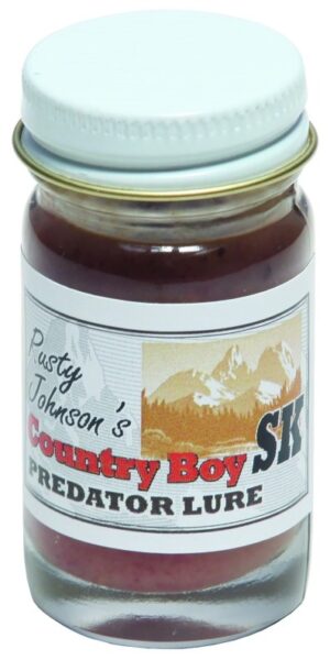 Small glass jar of "Rusty Johnson's Country Boy SK Lure" with mountain graphic, sealed with a metal lid.