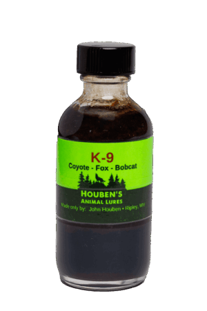 A small bottle labeled "Houben's K-9 Interceptor" for coyote, fox, and bobcat lures by Houben's Animal Lures, Ripley, WV.