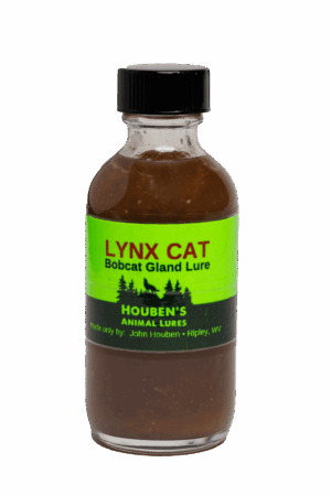 A small 2 oz glass bottle labeled "Houben's Lynx Cat Lure" with a green label, containing a dark liquid.