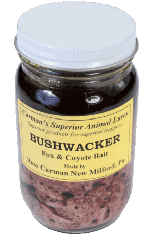 Carman's Bushwacker Bait jar with yellow label, ideal for fox and coyote trapping with its dark contents.