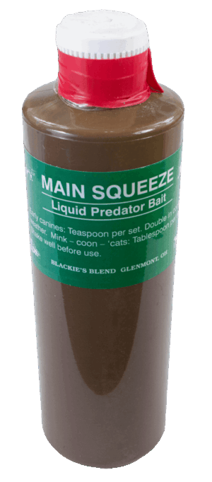A "Blackie's Main Squeeze Bait" bottle with a red cap and detailed usage instructions printed on the container.