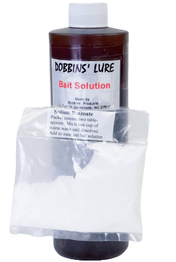 Dobbins' Bait Solution bottle includes sodium benzoate packet under label for optimal canine lure.