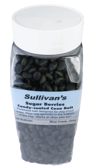 A clear plastic bottle labeled "Sullivan's Sugar Berries Bait" contains dark, candy-coated coon bait.