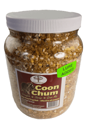 A plastic jar labeled "Mark June's Coon Chum" contains brown crumbly coon bait with a "Lure Added" sticker.