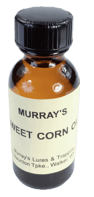 Amber bottle labeled "Murray's Sweet Corn Essence Oil," for lures and trapping, from Walker, WV.