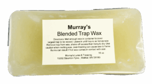 Murray's Yellow Trap Wax block with directions and company details in black on translucent yellow water trapping wax.