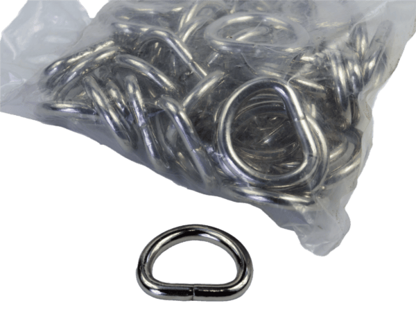 A bag of 1 Inch D-Ring with one placed outside on a white surface.