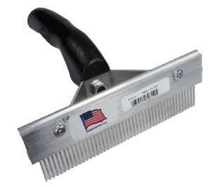 Heavy Duty Fur Comb with a black handle, metal teeth, and an American flag sticker.