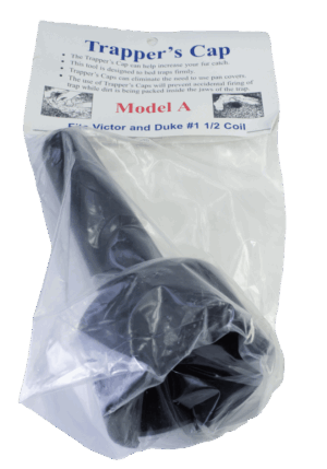 Packaged black "Trapper's Cap" Model A protects trap pans and includes labeled instructions.