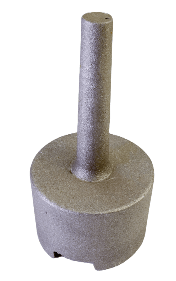 A rough, cylindrical metallic object is the Cast Aluminum Trapper Cap with a central rod from a wider base.