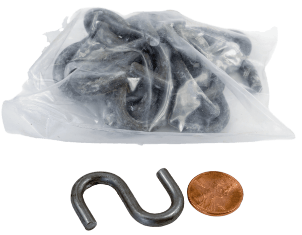 A bag of Mighty Hooks with one hook outside, shown next to a penny for scale.