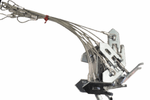 A set of metallic climbing nuts with attached cables and a red tie, similar to Wolf Fang Earth Anchors with Cable, on white.