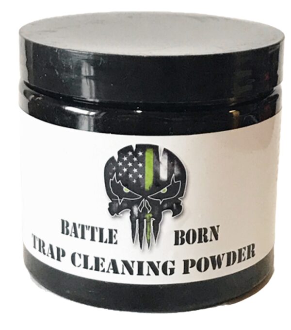 White container, black lid labeled "Battle Born Trap Cleaner by Southern Snares," with skull & American flag design.